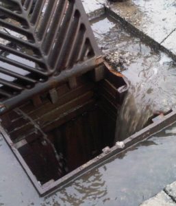 Photo of catch basin collecting water